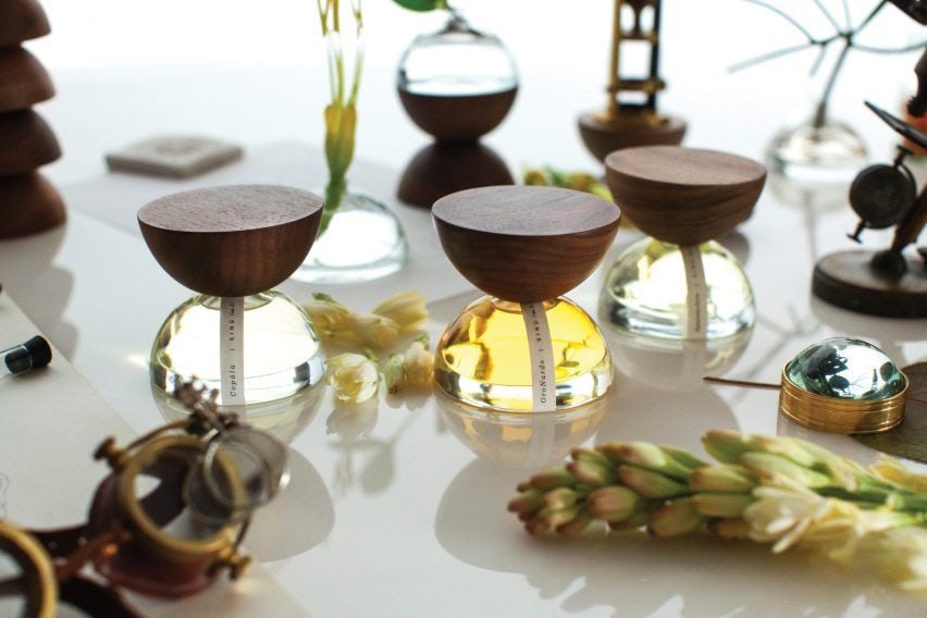 round glass bottles topped with wooden stoppers